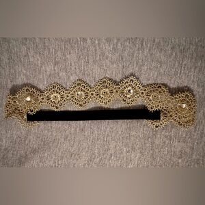 Adorable rhinestone embellished gold lace baby headband!